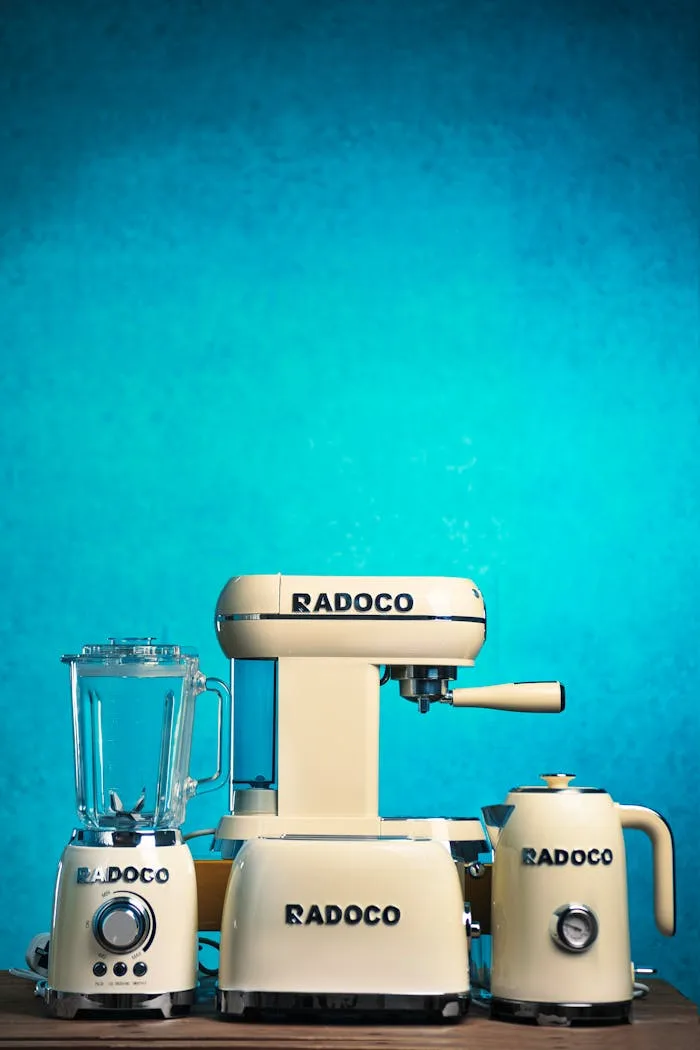 Retro cream kitchen appliances from Radoco on a blue background.