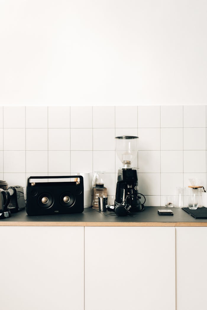 Stylish kitchen setup with a coffee maker and sleek design elements on a minimalist counter.